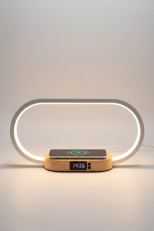 Bedside lamp with wireless charging pad on white studio background