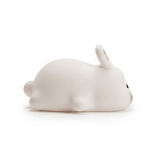 Side profile of silicone bunny night light showing rounded form