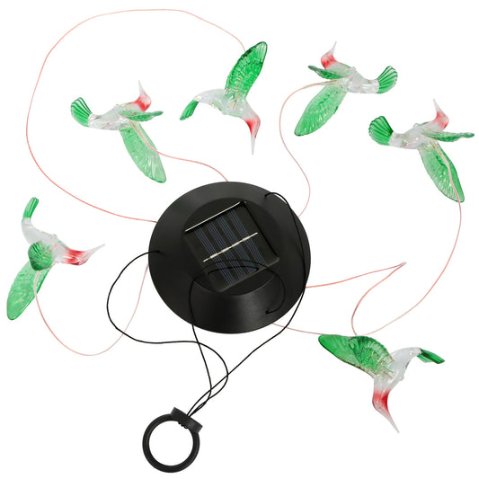 Hummingbird solar light hanging on a porch with soft multicolor glow