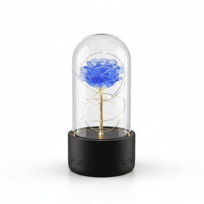Rose LED night light with black base and blue flower on white background