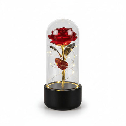 Rose LED night light with black base and red flower on white background