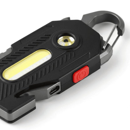 Close-up of COB keychain light showing LED chip and clip detail