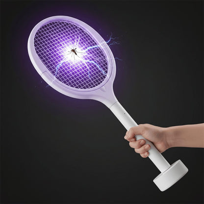 Electric bug zapper racket shown in action swatting insects outdoors
