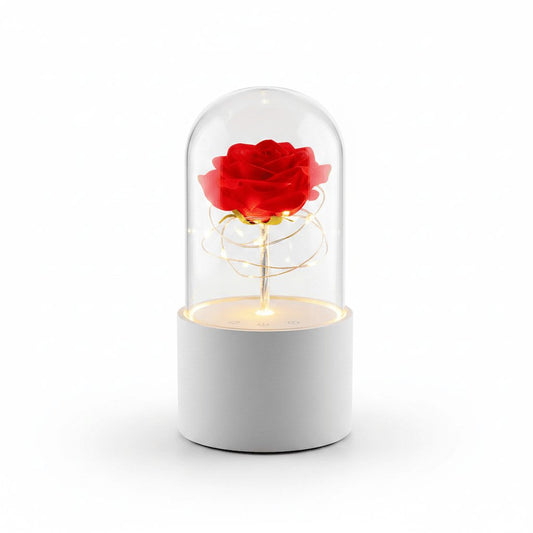 Rose LED night light with Bluetooth speaker on white studio background