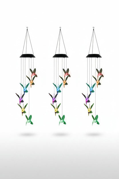 Solar hummingbird wind chime light 3-pack set on white studio background