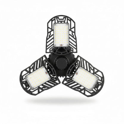 Deformable LED garage light with tri-blade panel on white studio background