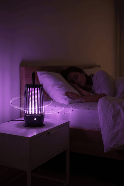 Rechargeable bug zapper lamp on nightstand providing mosquito protection at night