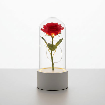 Rose LED night light with white base and red flower on white background